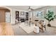 Comfortable living room featuring built-in shelving, a fireplace, neutral tones, and ample natural light at 17979 E Dorado Dr, Centennial, CO 80015