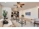 Open-concept living area with a view of the modern kitchen, hardwood floors, and stylish decor at 17979 E Dorado Dr, Centennial, CO 80015