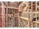 A rustic wine cellar with brick walls and custom wood racking to showcase your collection at 17979 E Dorado Dr, Centennial, CO 80015