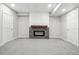 Finished basement with stone fireplace and neutral gray carpet at 965 Peach Leaf Ln, Elizabeth, CO 80107