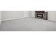Finished basement showcasing a stone fireplace and neutral carpet at 965 Peach Leaf Ln, Elizabeth, CO 80107