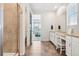 Spacious bathroom with walk-in shower, dual sinks, and neutral tile flooring at 965 Peach Leaf Ln, Elizabeth, CO 80107
