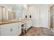 Bright bathroom featuring double sinks, granite counters, and a glass enclosed shower at 965 Peach Leaf Ln, Elizabeth, CO 80107