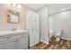 Neutral toned bathroom with wood-look floors, a shower/tub and modern vanity at 965 Peach Leaf Ln, Elizabeth, CO 80107