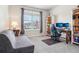 Comfortable bedroom features natural light, a work space, and neutral decor for relaxation at 965 Peach Leaf Ln, Elizabeth, CO 80107