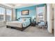 Relaxing bedroom with bright windows, soft blue walls and neutral gray carpet at 965 Peach Leaf Ln, Elizabeth, CO 80107