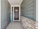 Charming entryway with a welcoming sign and well-decorated front door at 965 Peach Leaf Ln, Elizabeth, CO 80107