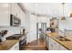 Modern kitchen with stainless steel appliances, granite countertops, and an island for food preparation at 965 Peach Leaf Ln, Elizabeth, CO 80107