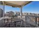 Comfortable outdoor patio space offering seating and neighborhood views under a clear blue sky at 965 Peach Leaf Ln, Elizabeth, CO 80107