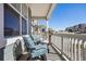 Relaxing porch with seating, offering neighborhood views and a comfortable outdoor space at 965 Peach Leaf Ln, Elizabeth, CO 80107