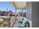 Cozy covered porch with comfortable seating, perfect for relaxing and enjoying the neighborhood views at 965 Peach Leaf Ln, Elizabeth, CO 80107