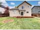Backyard with deck and grass area, perfect for outdoor living and entertaining at 5521 Spruce Ave, Castle Rock, CO 80104
