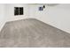 A finished basement featuring neutral carpeting and a window for natural light at 5521 Spruce Ave, Castle Rock, CO 80104