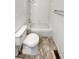 Clean bathroom featuring a white tile shower-tub, toilet, and neutral tile flooring at 5521 Spruce Ave, Castle Rock, CO 80104