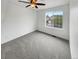 Carpeted bedroom with ceiling fan and view to the outside at 5521 Spruce Ave, Castle Rock, CO 80104