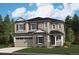 Charming two-story home featuring stone accents, a covered porch, and an attached two-car garage at 25171 E Evans Dr, Aurora, CO 80018
