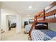 Spacious area with bunk beds, a seating area, and a home gym at 5129 Pasadena Way, Broomfield, CO 80023
