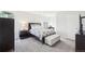 Comfortable bedroom featuring neutral tones, a bed with patterned linens, and ample natural light at 5129 Pasadena Way, Broomfield, CO 80023