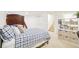 Bright bedroom area featuring bunkbeds, shelving, and access to the hallway stairs at 5129 Pasadena Way, Broomfield, CO 80023
