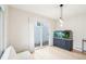 Bright dining room featuring an aquarium, a sliding glass door, and modern pendant lighting at 5129 Pasadena Way, Broomfield, CO 80023