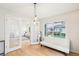Bright living area with french doors, a large window with backyard views, and comfortable seating at 5129 Pasadena Way, Broomfield, CO 80023