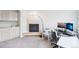 Inviting living space featuring a fireplace, wet bar, and office setup, ideal for work and relaxation at 5129 Pasadena Way, Broomfield, CO 80023