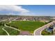 Aerial view showcasing the neighborhood green space and surrounding community at 6932 E 133Rd Ave, Thornton, CO 80602