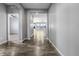 Inviting hallway features beautiful hardwood floors and neutral paint at 6932 E 133Rd Ave, Thornton, CO 80602