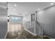 Bright, open living space with hardwood floors and staircase at 6932 E 133Rd Ave, Thornton, CO 80602
