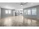 Inviting open floor plan with hardwood floors, white cabinets, and stainless steel appliances at 6932 E 133Rd Ave, Thornton, CO 80602