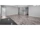 Bright living room boasts hardwood floors, neutral paint, and an open concept design perfect for entertaining at 6932 E 133Rd Ave, Thornton, CO 80602