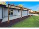 A charming back patio featuring a wooden pergola with decorative lighting, creating a cozy outdoor living space at 8236 W 71St Pl, Arvada, CO 80004