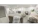 Finished basement with ample space for recreation, a wet bar, and comfortable seating at 8236 W 71St Pl, Arvada, CO 80004