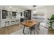 Elegant dining area adjacent to the kitchen, perfect for Gathering meals and entertaining guests at 8236 W 71St Pl, Arvada, CO 80004