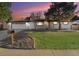 Charming ranch-style home boasts a well-maintained lawn, attractive landscaping, and a two-car garage at 8236 W 71St Pl, Arvada, CO 80004