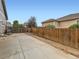 Large fenced backyard area with concrete patio and room for entertaining at 8522 S Dudley St, Littleton, CO 80128