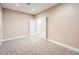 Bedroom with double door entrance and carpeted floors at 8522 S Dudley St, Littleton, CO 80128