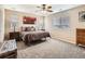 Comfortable bedroom with ceiling fan, and neutral carpeting at 8522 S Dudley St, Littleton, CO 80128