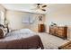 Neutral bedroom features a ceiling fan and bright natural light at 8522 S Dudley St, Littleton, CO 80128