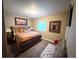 Comfortable bedroom features carpeted floor, natural light and a king size bed at 8522 S Dudley St, Littleton, CO 80128