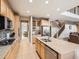 Modern kitchen featuring stainless steel appliances, granite counters, and easy access to dining area at 8522 S Dudley St, Littleton, CO 80128