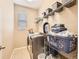 Functional laundry room with modern appliances and ample storage shelving at 8522 S Dudley St, Littleton, CO 80128