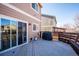 Enjoy outdoor living on this spacious deck with a grill, perfect for entertaining guests or relaxing in the sun at 1099 Thornbury Pl, Highlands Ranch, CO 80129
