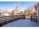 Back deck with seating offers a serene outdoor space with views of the backyard and surrounding neighborhood at 1099 Thornbury Pl, Highlands Ranch, CO 80129