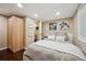 Comfortable bedroom with a neutral palette, closet and wardrobe, and modern decor, offering a relaxing space at 1099 Thornbury Pl, Highlands Ranch, CO 80129