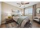 Cozy bedroom with a comfortable bed, stylish rug, and plenty of natural light from the window at 1099 Thornbury Pl, Highlands Ranch, CO 80129