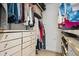 Walk-in closet with built-in shelving and ample storage space for clothes and shoes at 1099 Thornbury Pl, Highlands Ranch, CO 80129