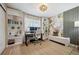 Well-lit home office with built-in bookshelves, a large desk, and stylish decor for a productive workspace at 1099 Thornbury Pl, Highlands Ranch, CO 80129