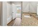 Bright bathroom featuring granite counters and tile shower and tub combo at 770 Twining Ave, Brighton, CO 80601