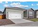 Charming single-Gathering home with an attached two-car garage, complemented by a well-kept lawn at 770 Twining Ave, Brighton, CO 80601